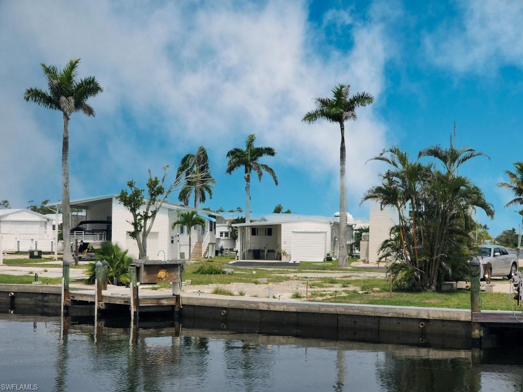 Back of house featuring a water view