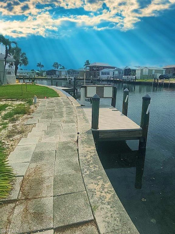 Dock area featuring a water view and a residential view