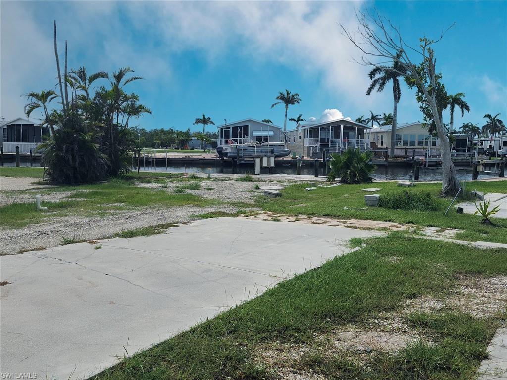 View of yard featuring a water view and a residential view