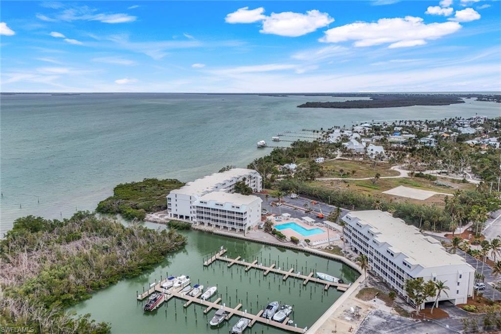 Birds eye view of property featuring a water view