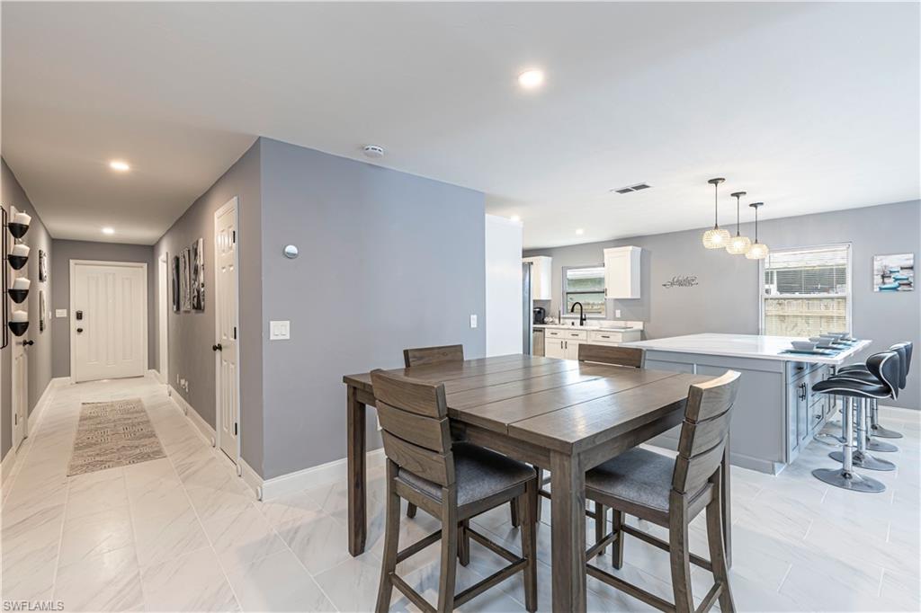 Dining area featuring baseboards and recessed lighting