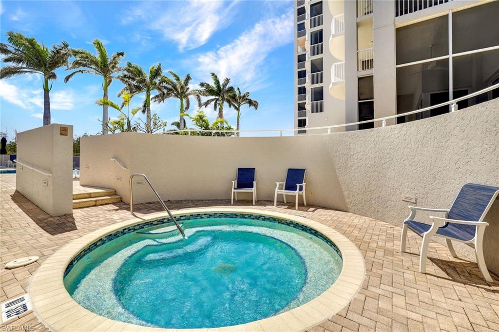 View of pool featuring a patio area and a community hot tub