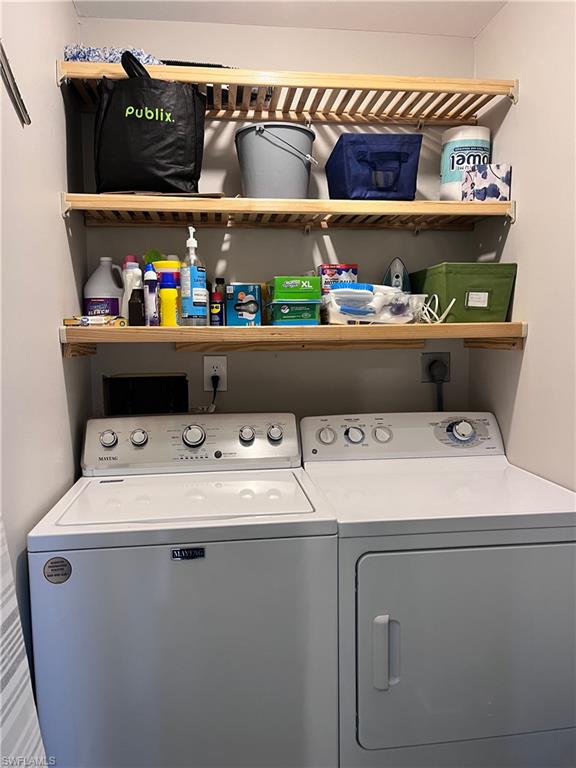 Laundry room in residence with lots of storage area.