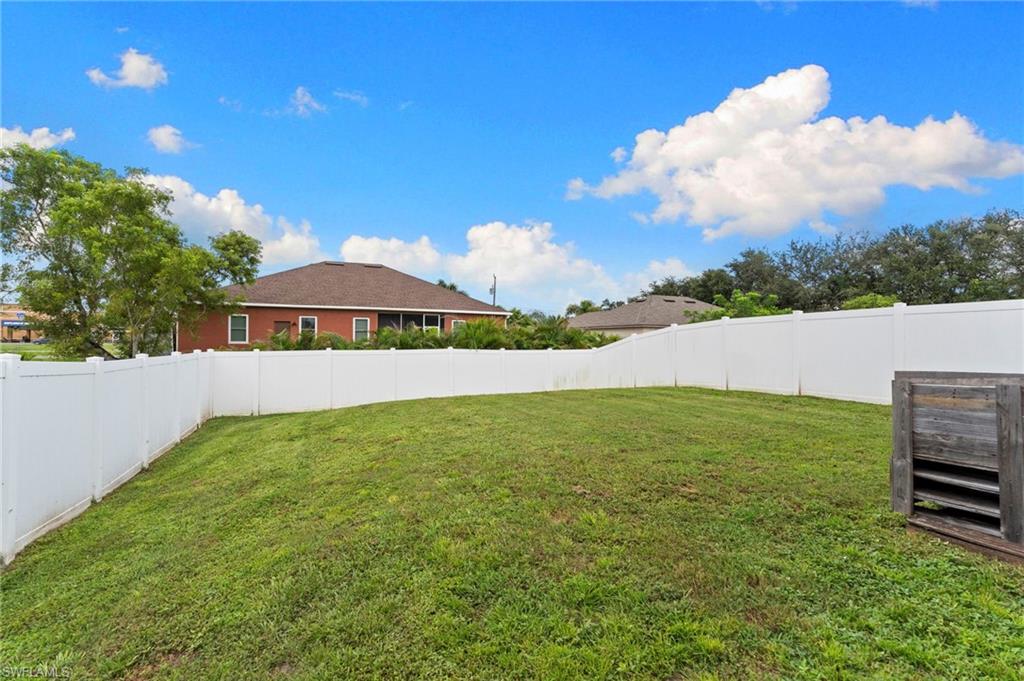 View of fenced backyard
