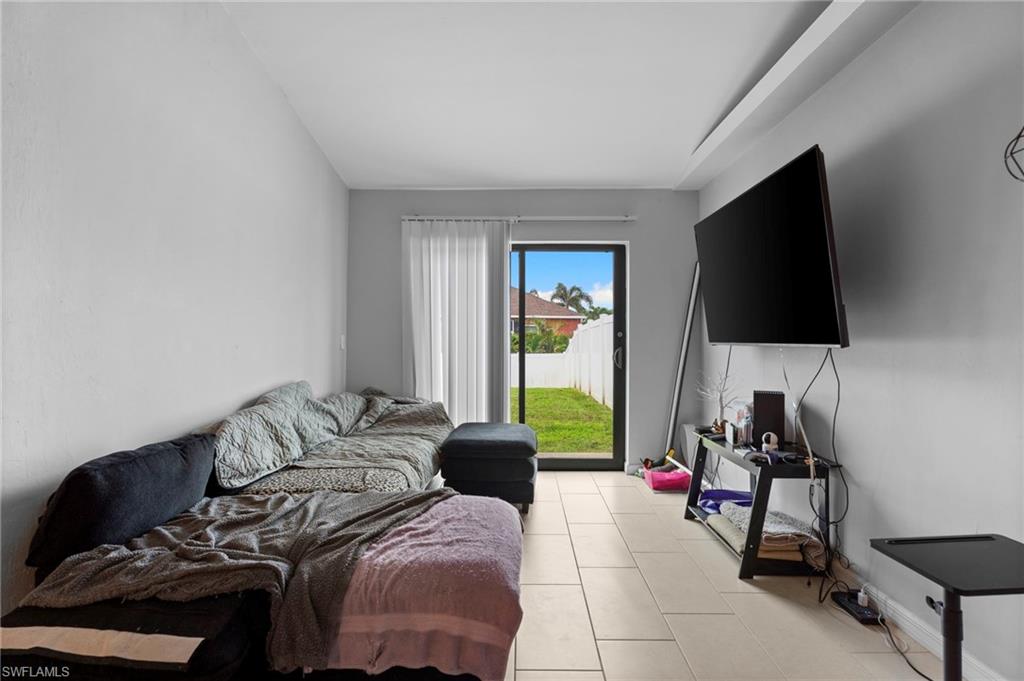 Living area featuring tile patterned floors