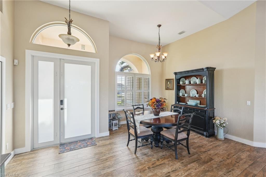 Dining space with a chandelier and light wood finished floors