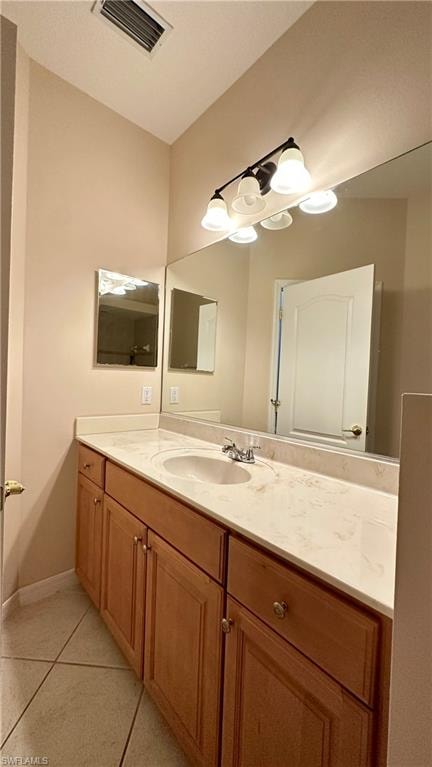 Bathroom featuring vanity and light tile patterned floors