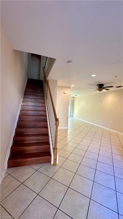 Stairs featuring tile patterned floors, a ceiling fan, and recessed lighting
