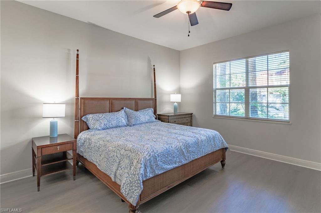 Very spacious Primary bedroom with sliding glass doors to screened lanai