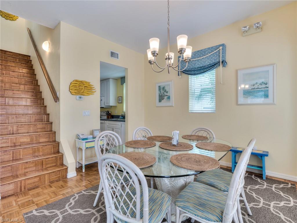 Dining room next to kitchen and stairs to 2nd floor