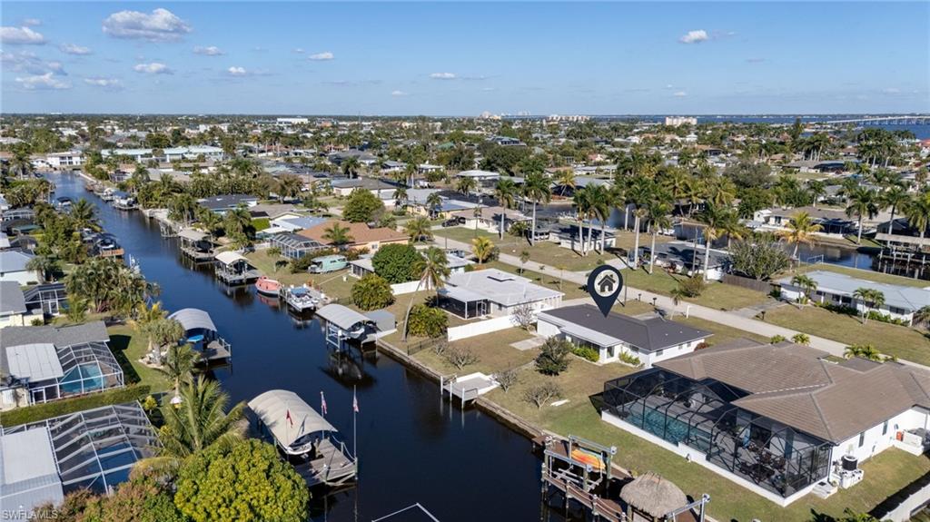 Aerial perspective of suburban area with a nearby body of water