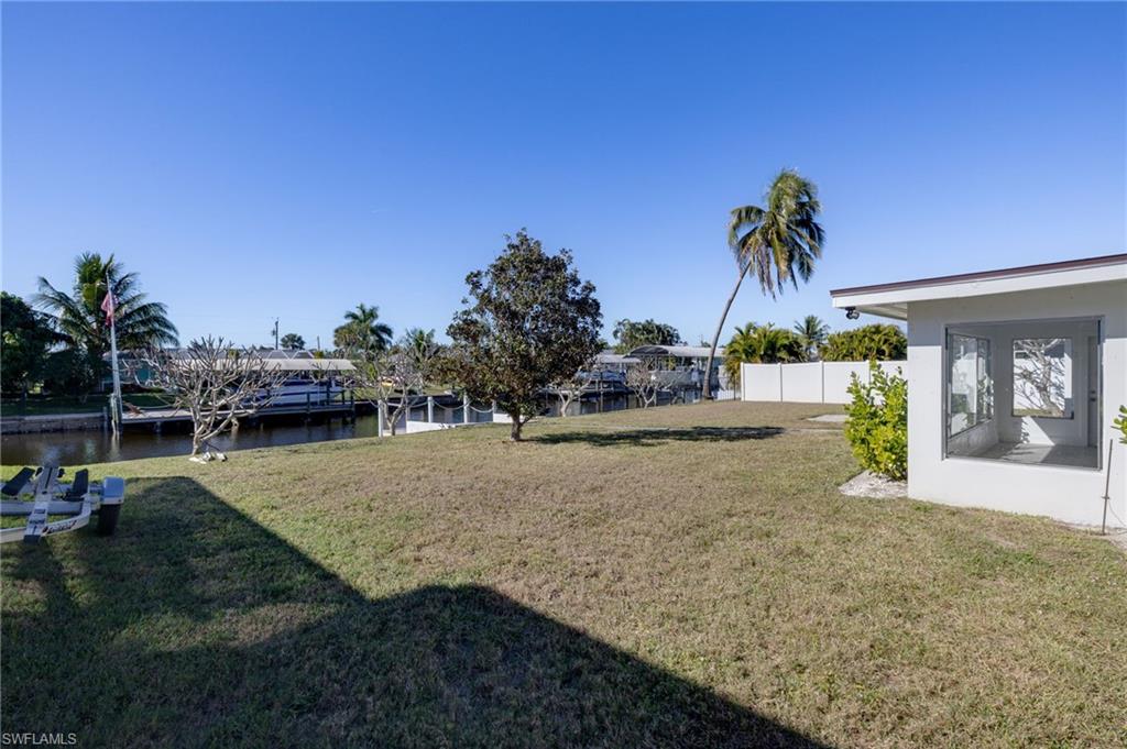 View of yard with a water view