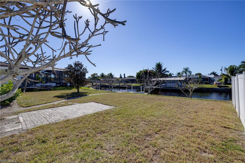 View of grassy yard featuring a water view
