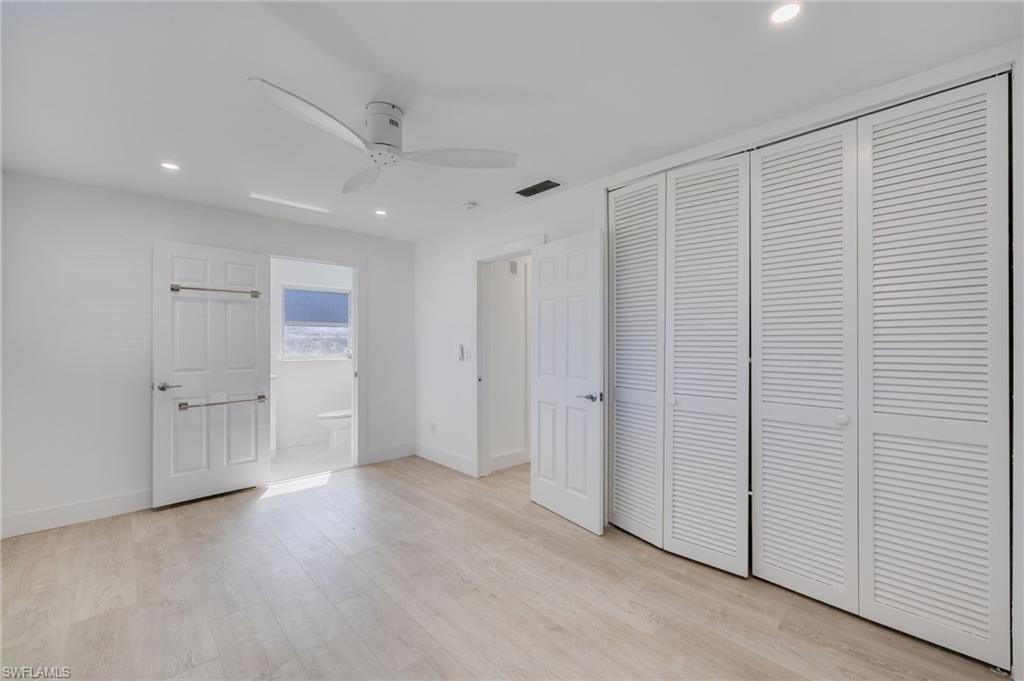 Unfurnished bedroom with recessed lighting, light wood finished floors, ceiling fan, and a closet