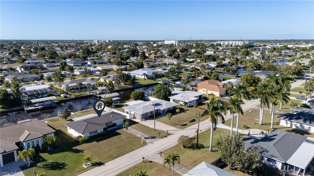 Aerial view of residential area with a nearby body of water