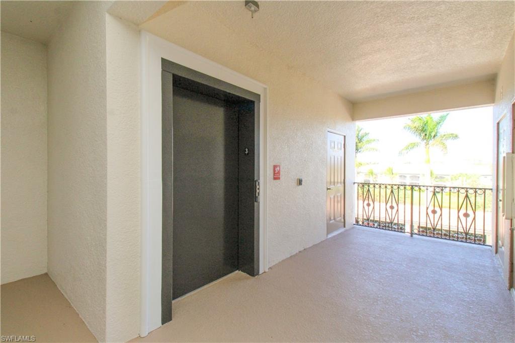 View of patio / terrace with a balcony and elevator