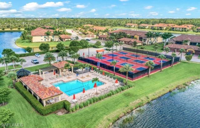 Birds eye view of property featuring a water view