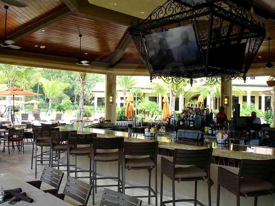 View of patio with a gazebo and an outdoor bar