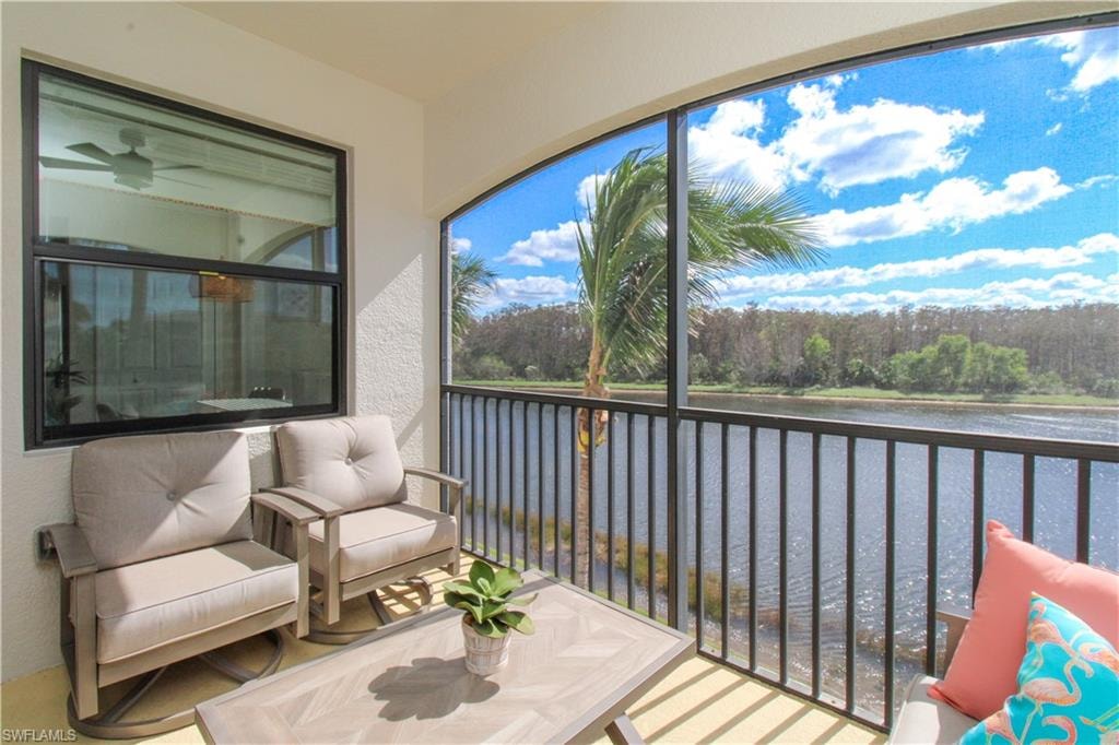 Sunroom with a water view