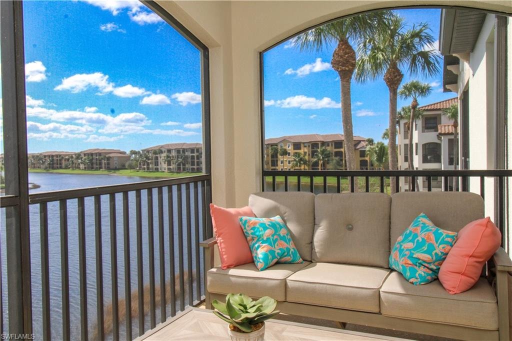 Sunroom / solarium with a water view