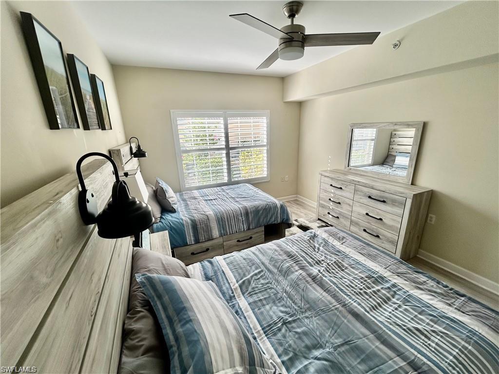 Bedroom featuring ceiling fan and wood finished floors