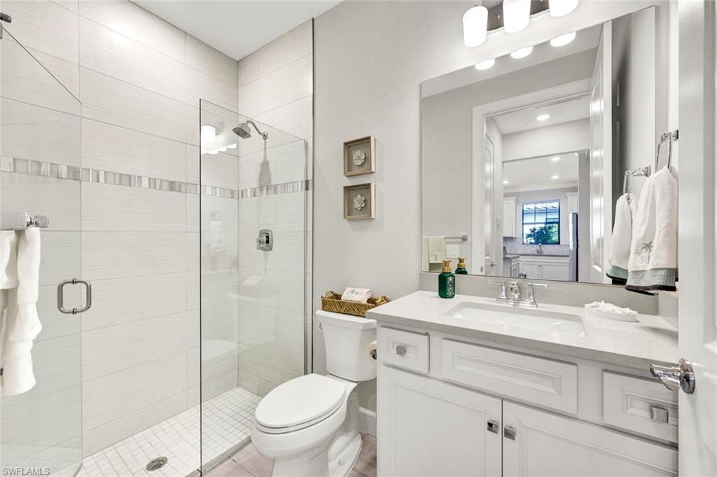 Bathroom with vanity and a stall shower