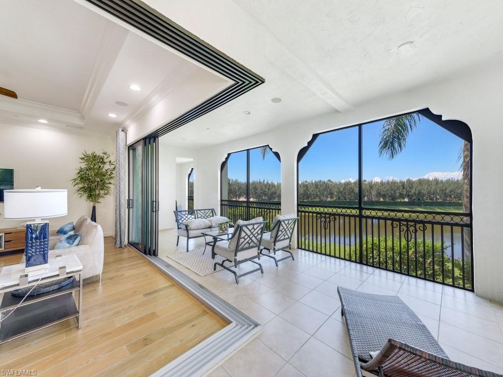 Sunroom featuring a water view