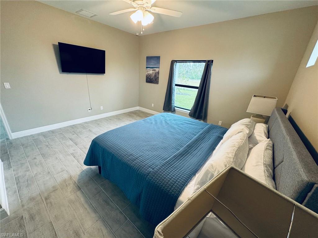 Bedroom featuring ceiling fan and wood finished floors