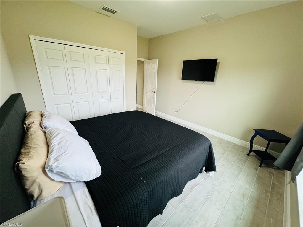 Bedroom with baseboards and a closet