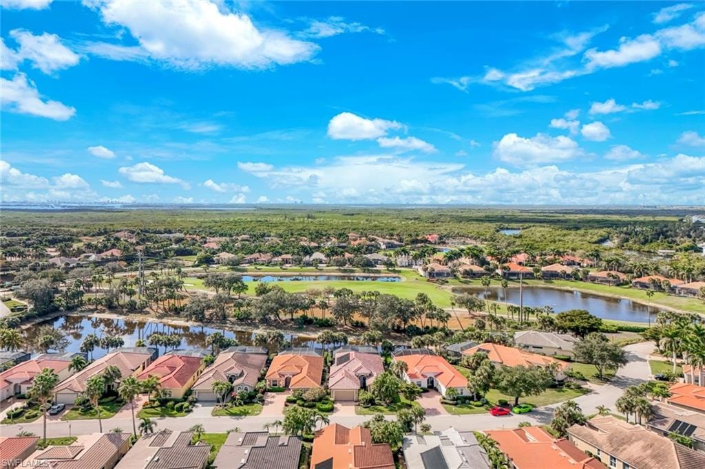 Aerial view of residential area with a nearby body of water