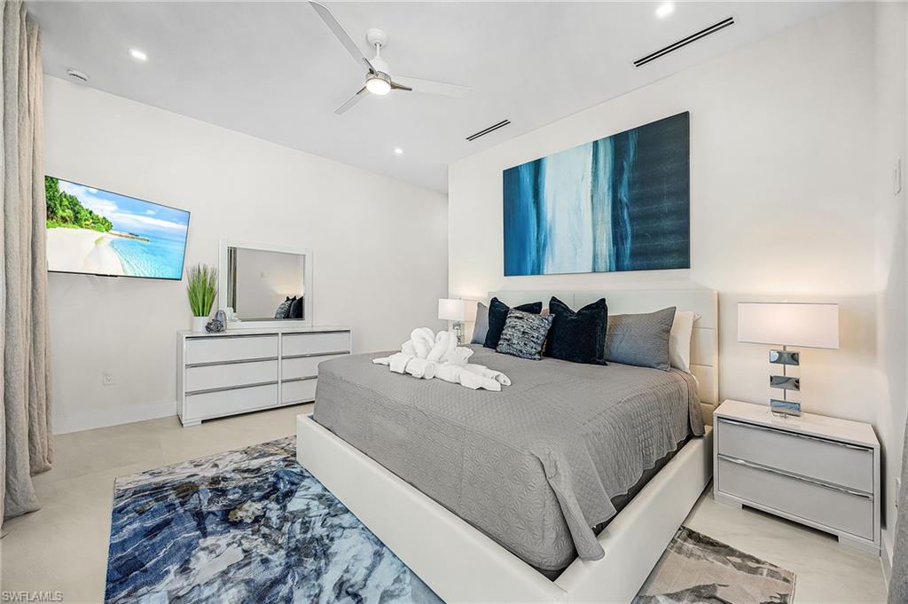 Bedroom featuring ceiling fan and baseboards - Virtually Edited Image