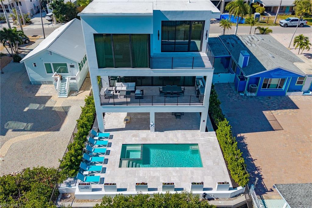 Aerial view of residential area with a pool - Virtually Edited Image