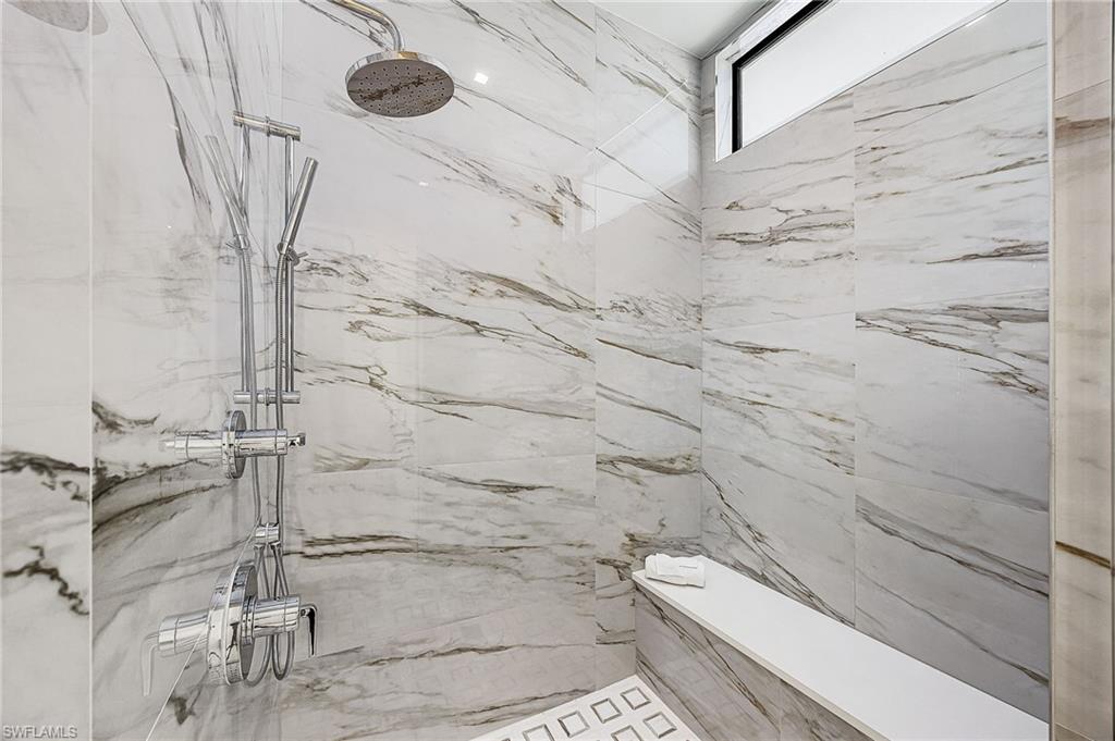 Bathroom with a marble finish shower - Virtually Edited Image