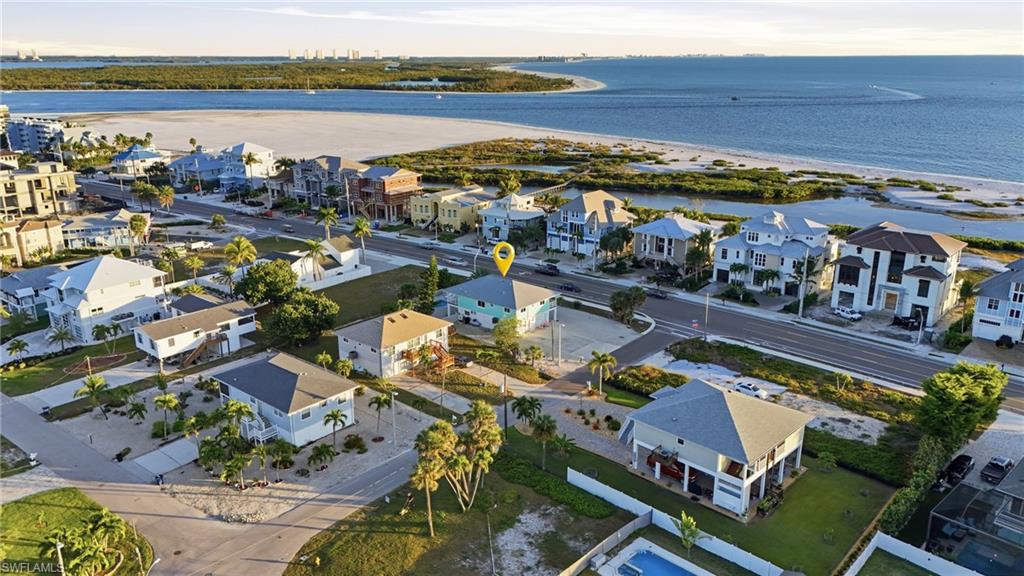 Aerial view of residential area with a nearby body of water - Virtually Edited Image