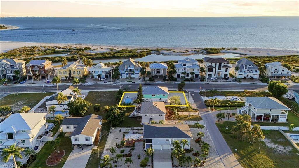 Aerial view of residential area with a large body of water - Virtually Edited Image