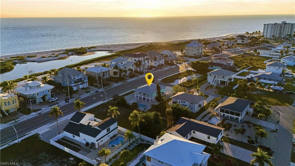 Aerial view of property and surrounding area featuring nearby suburban area - Virtually Edited Image