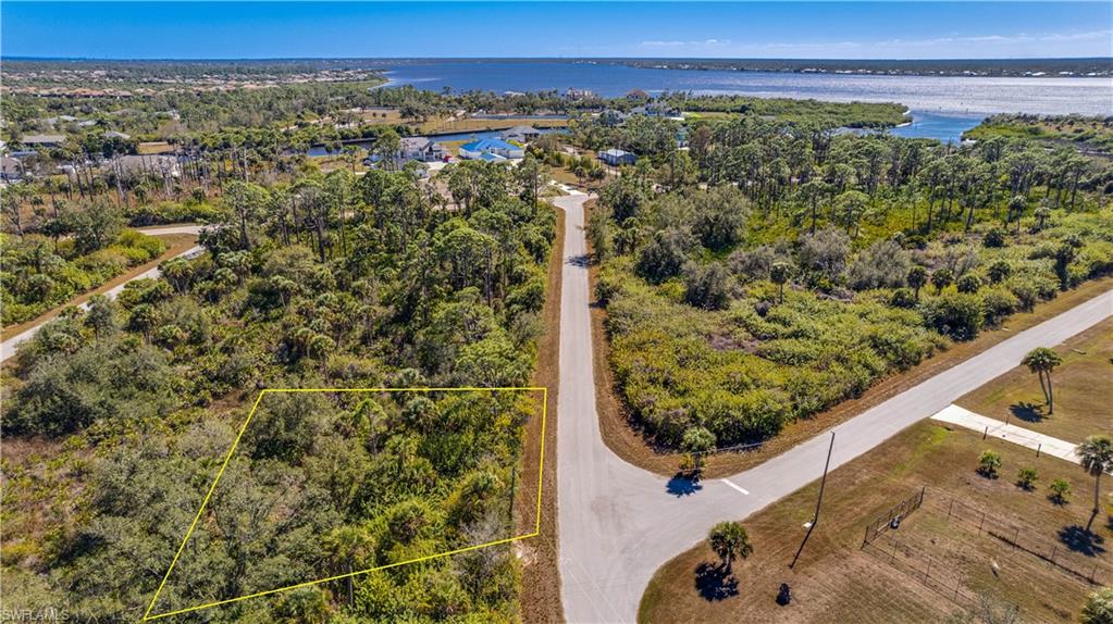 View of property location with a large body of water and property parcel outlined