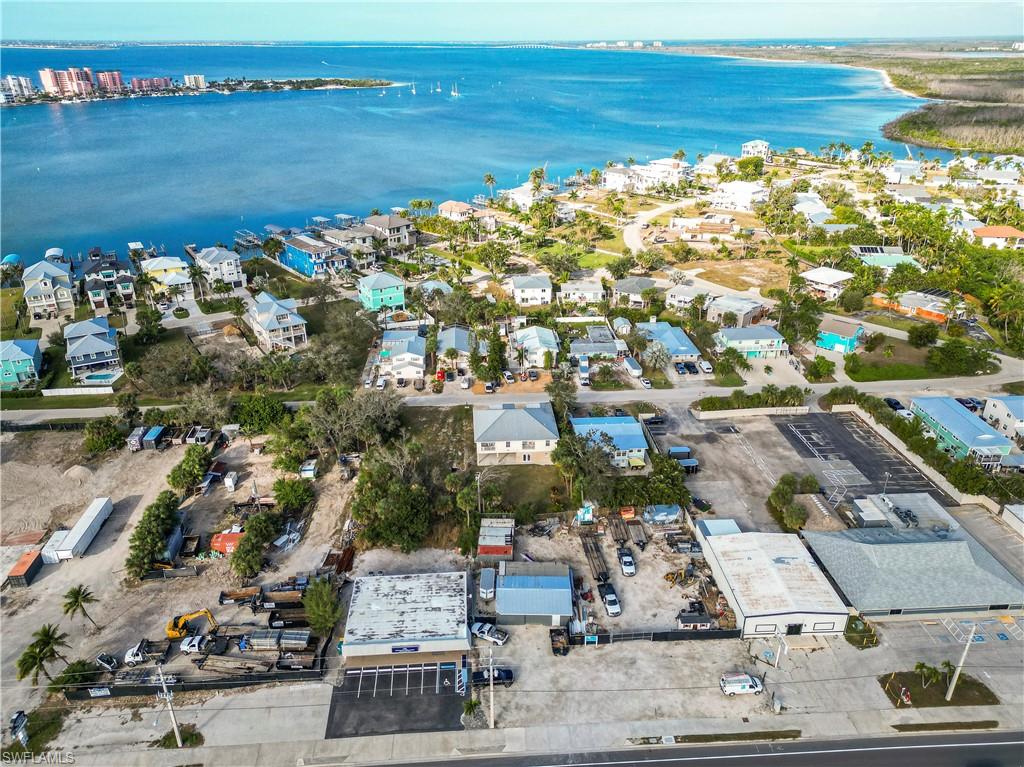 Aerial view of property's location with a nearby body of water