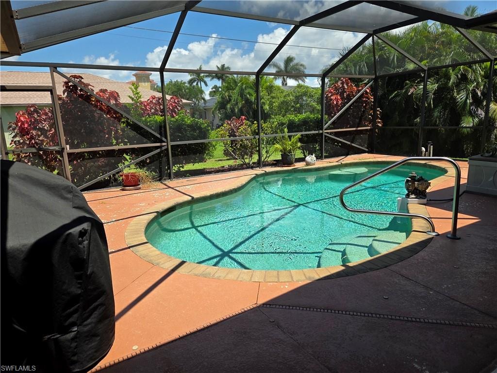 Pool showing sunny day and screen room