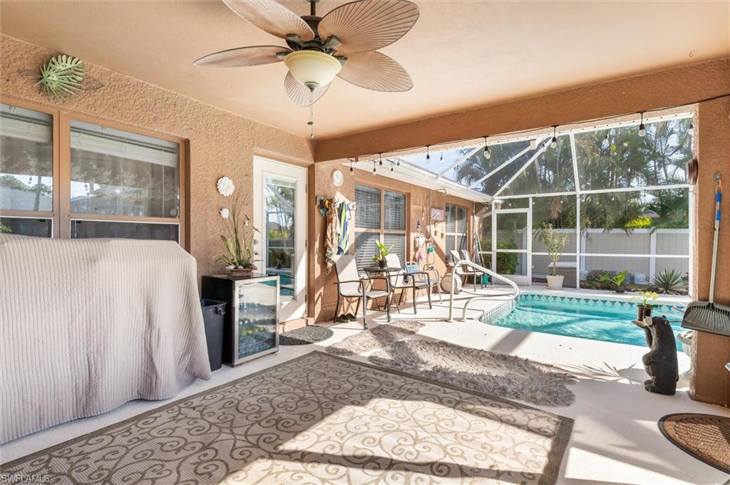 View of pool with a sunroom, a patio area, and a lanai