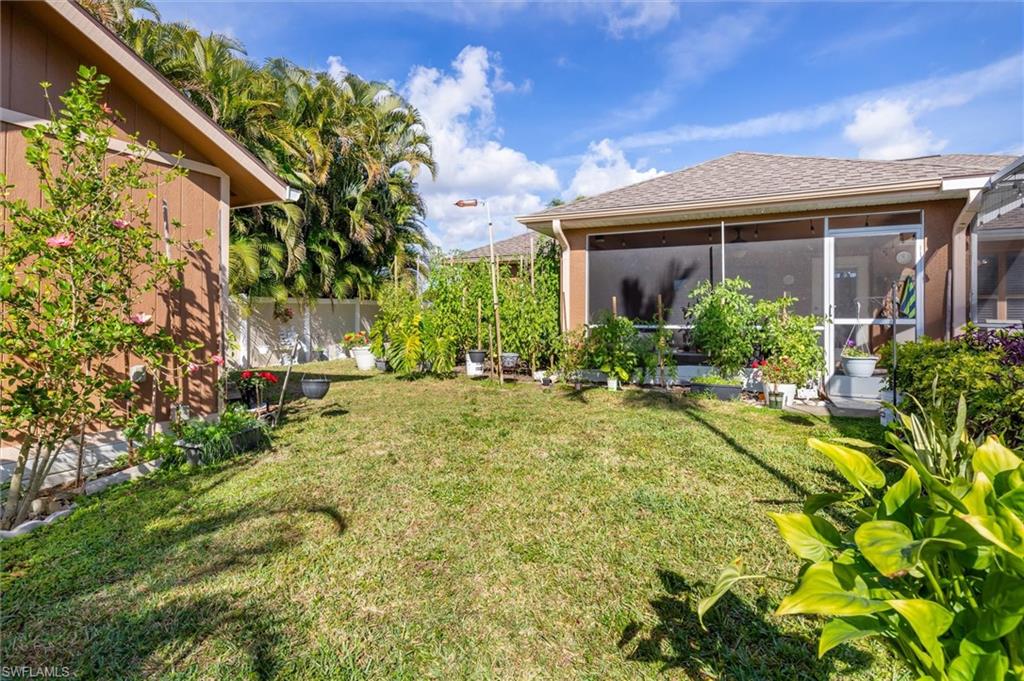 View of yard featuring a sunroom