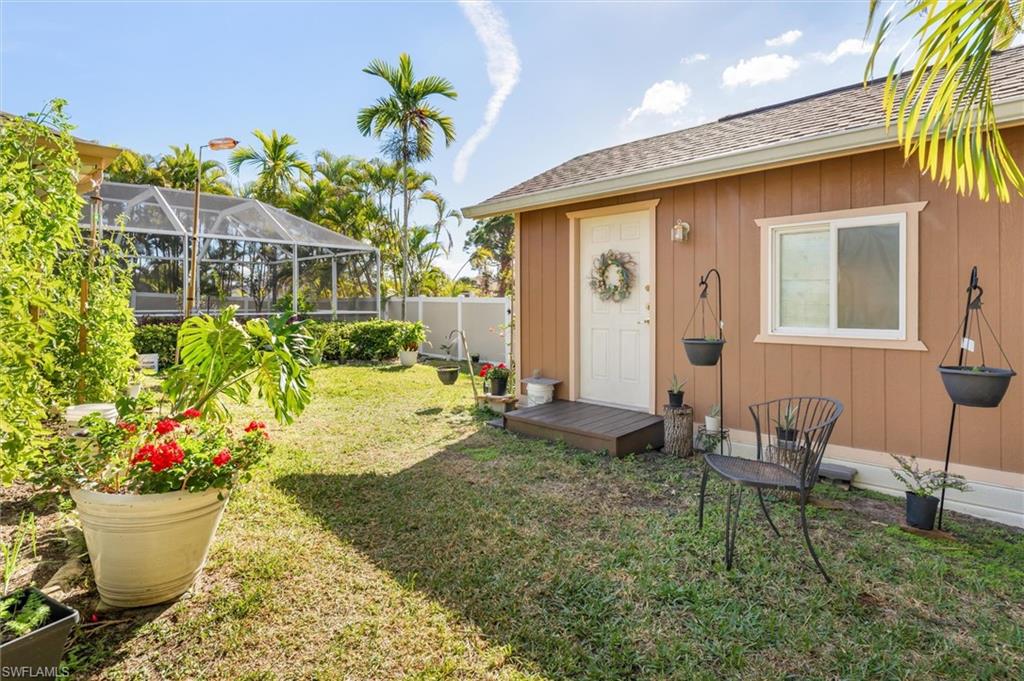 View of yard with a lanai