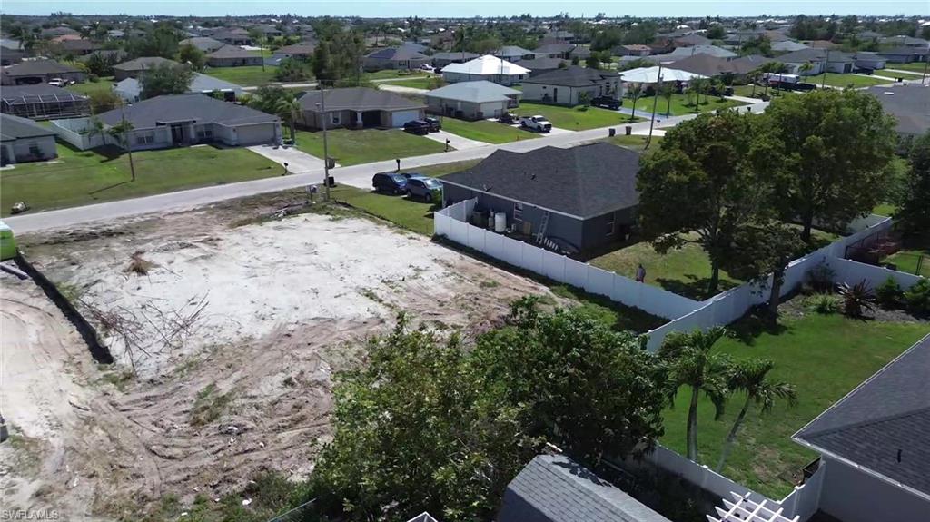View of property location with nearby suburban area