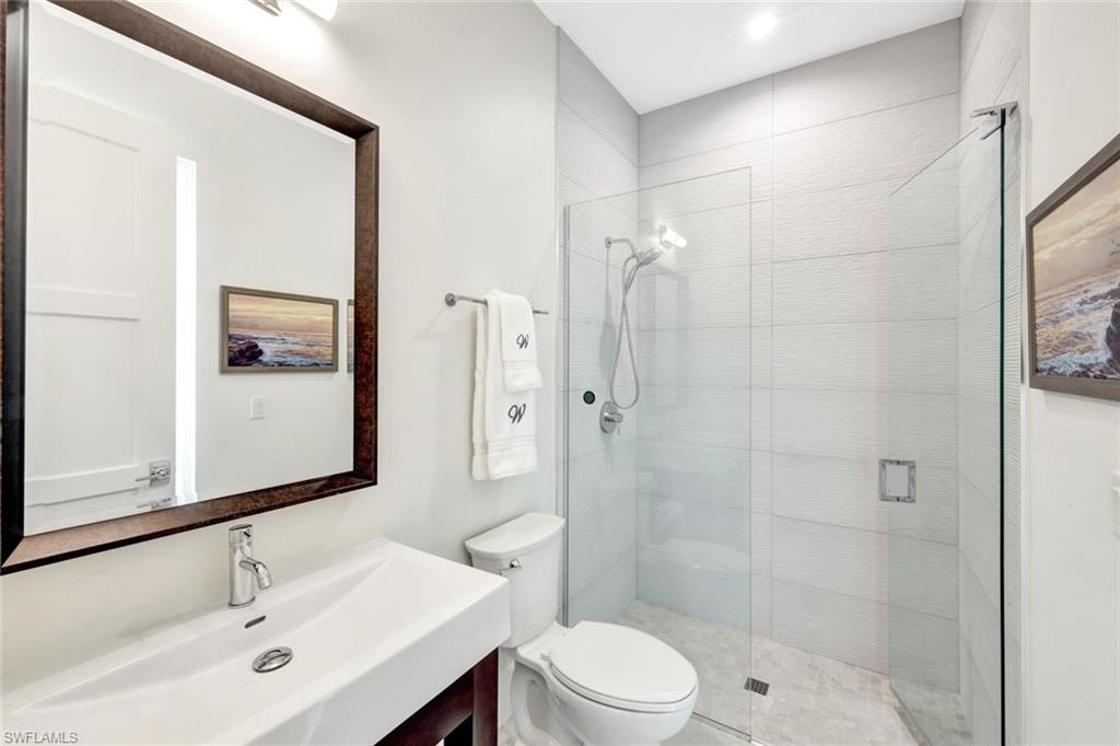 Bathroom featuring a stall shower and vanity
