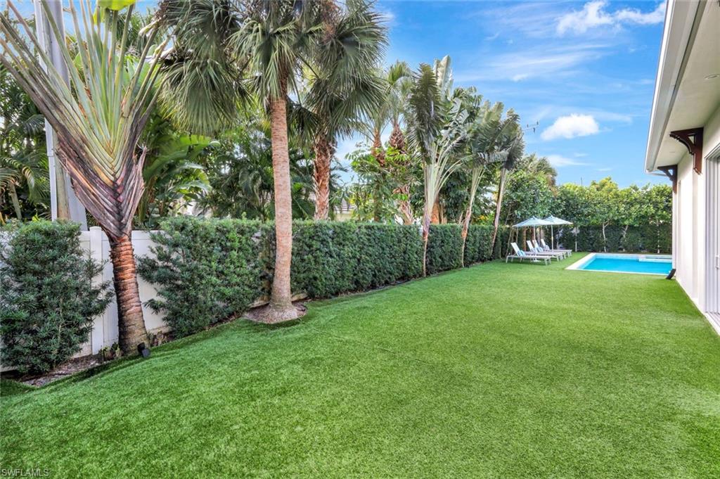 Fenced backyard with a patio