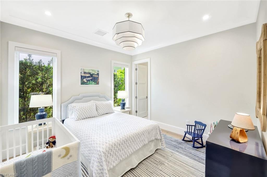 Bedroom featuring wood finished floors and recessed lighting