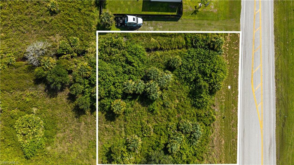 Aerial overview of property's location featuring property parcel outlined