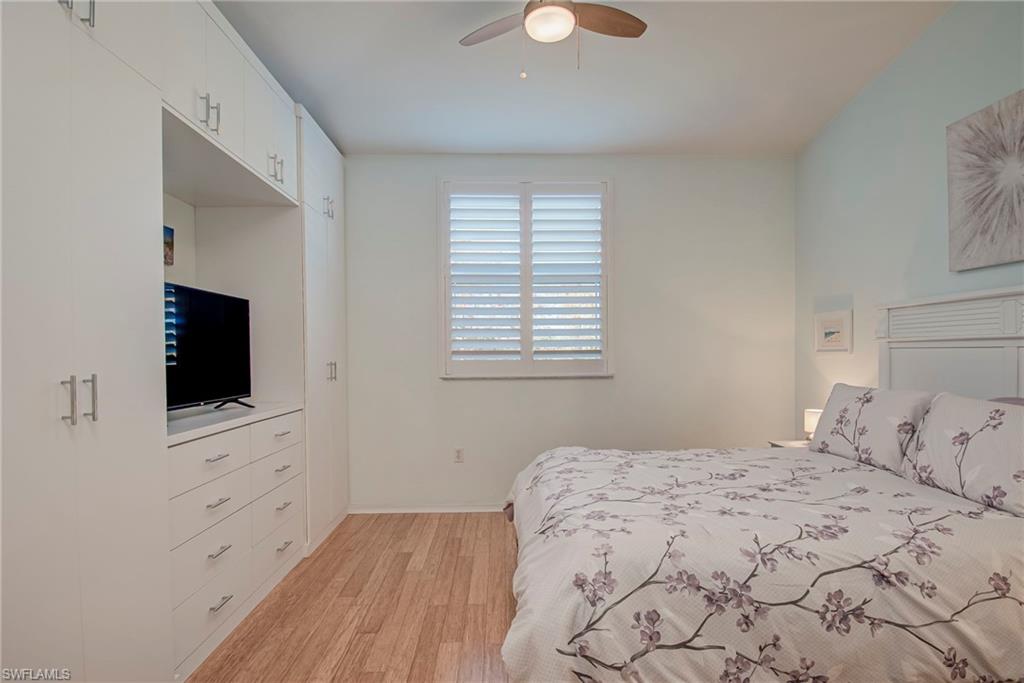 Bedroom with light wood-style floors and ceiling fan