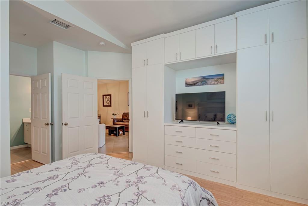 Bedroom with light wood-style floors and a closet