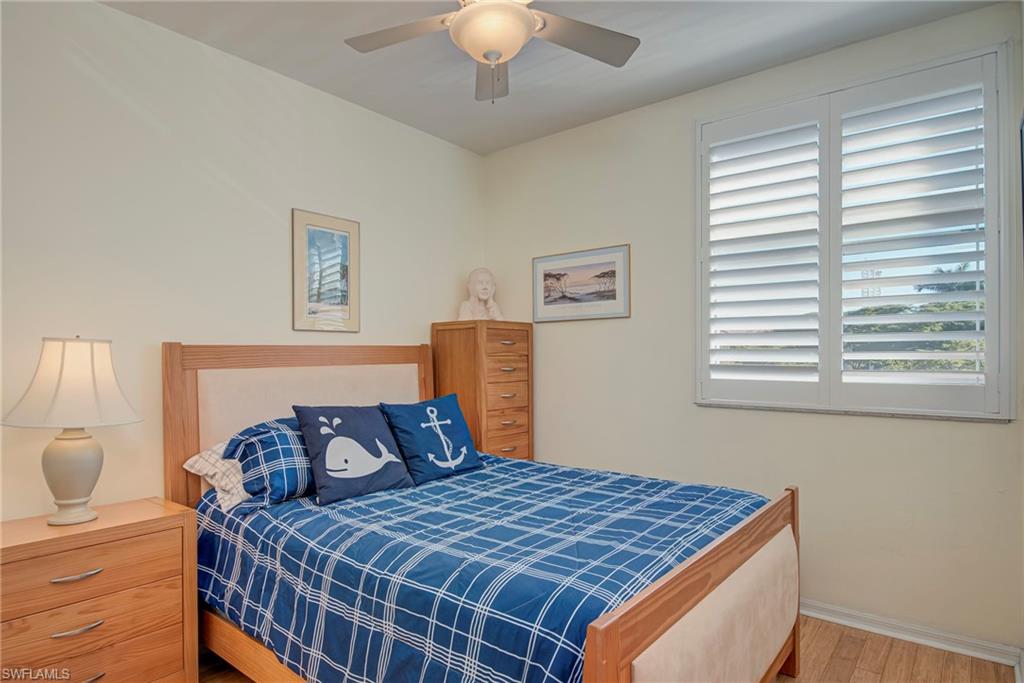 Bedroom with a ceiling fan and wood finished floors